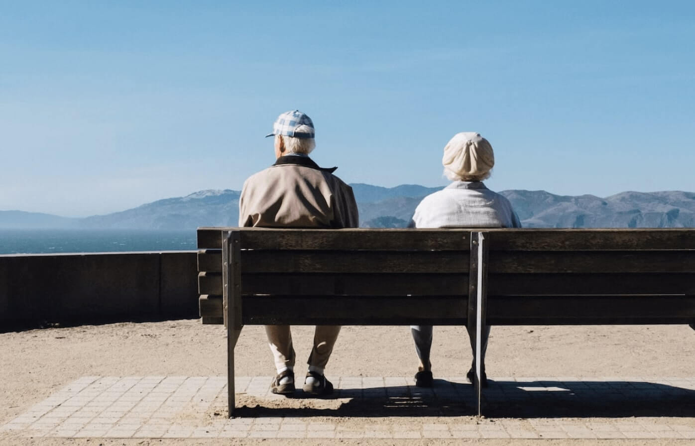 Old couple sitting on a bench